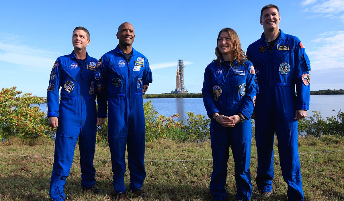NASA's Artemis II Commander Reid Wiseman, pilot Victor Glover, mission specialist Christina Koch, and Jeremy Hansen pose for a photo with NASA's Artemis II behind them. Pic: Getty Images