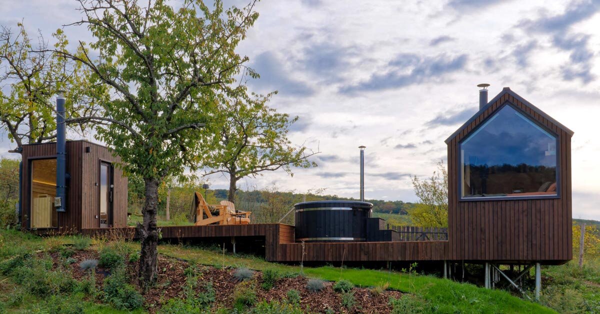 prefabricated timber micro-cabin extends living into the hungarian landscape