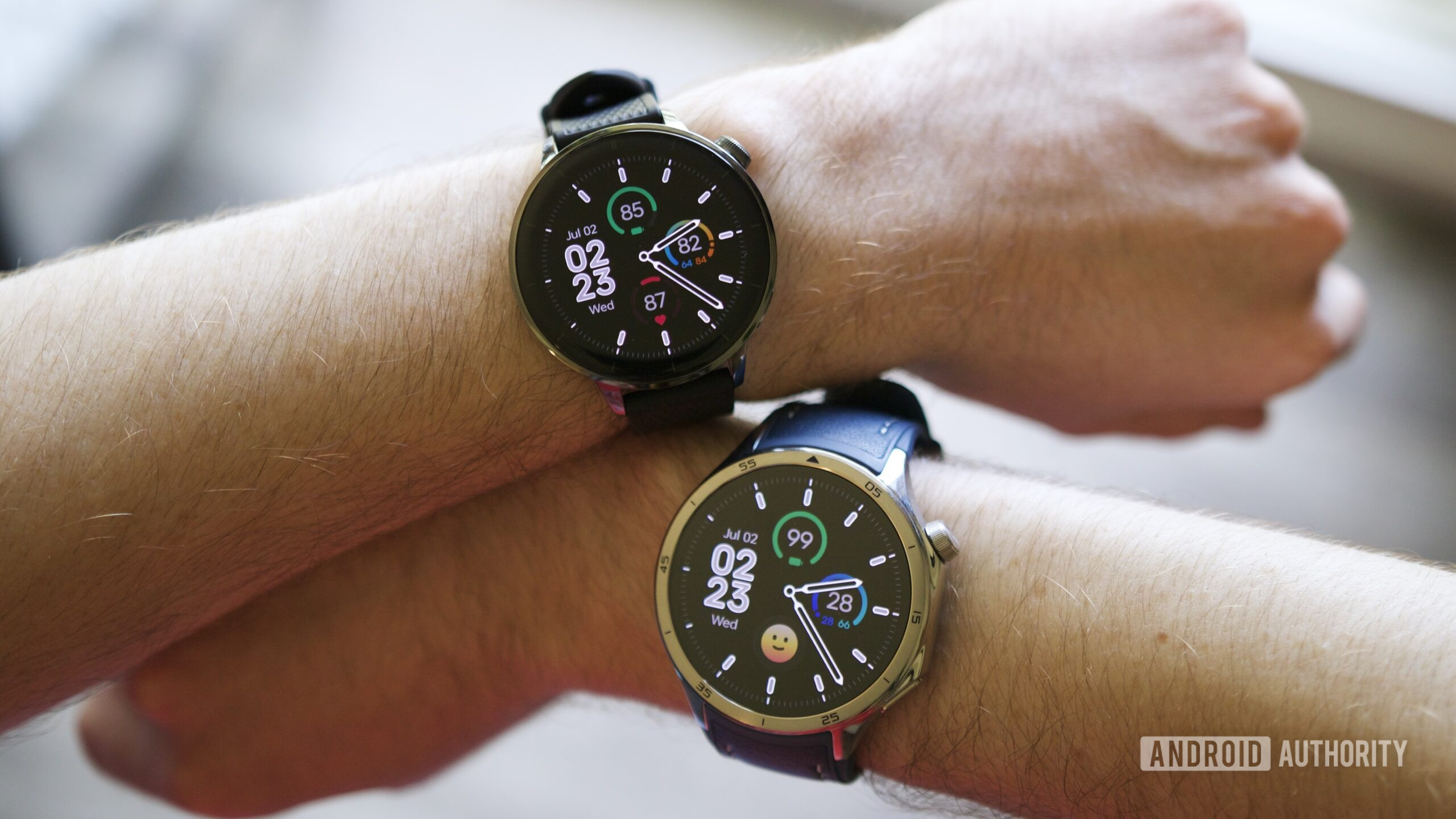 Someone wearing the OnePlus Watch 3 (43mm) and the regular OnePlus Watch 3.