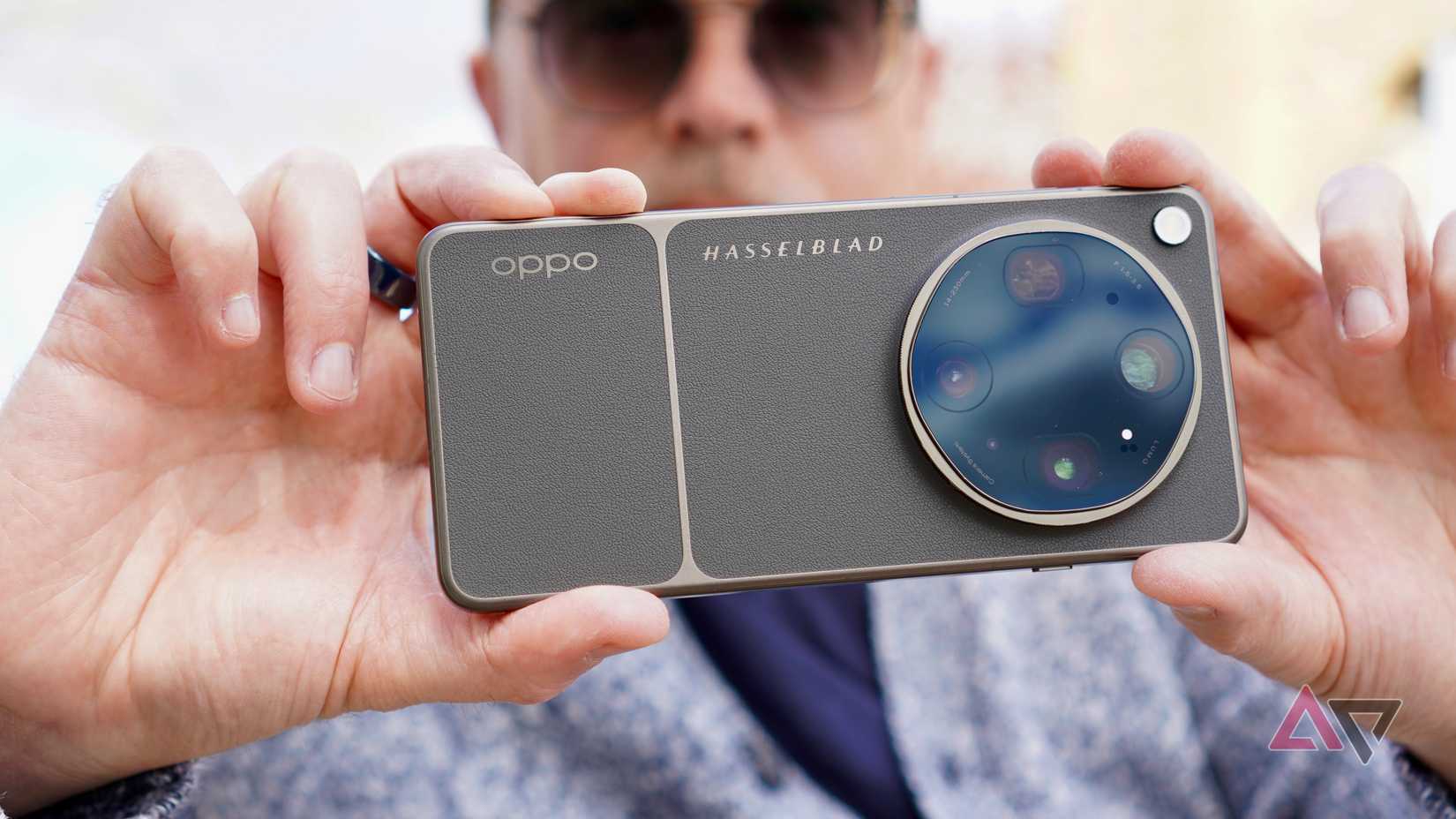 A person taking a photo with the Oppo Find X9 Ultra