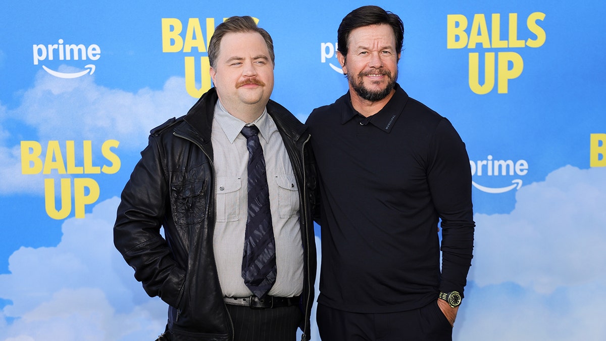 Paul Walter Hauser and Mark Wahlberg at the Los Angeles premiere of "Balls Up" in April 2026.