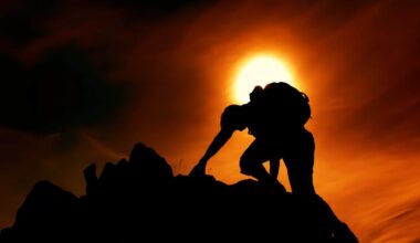 Photo by stein egil liland: https://www.pexels.com/photo/sun-over-silhouette-of-man-rock-climbing-20040806/