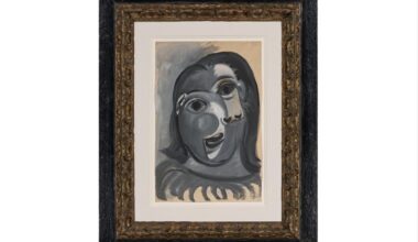 A picture of the framed Picasso painting, Tête de femme ( "Head of a Woman"), a very cubist portrait of a woman
