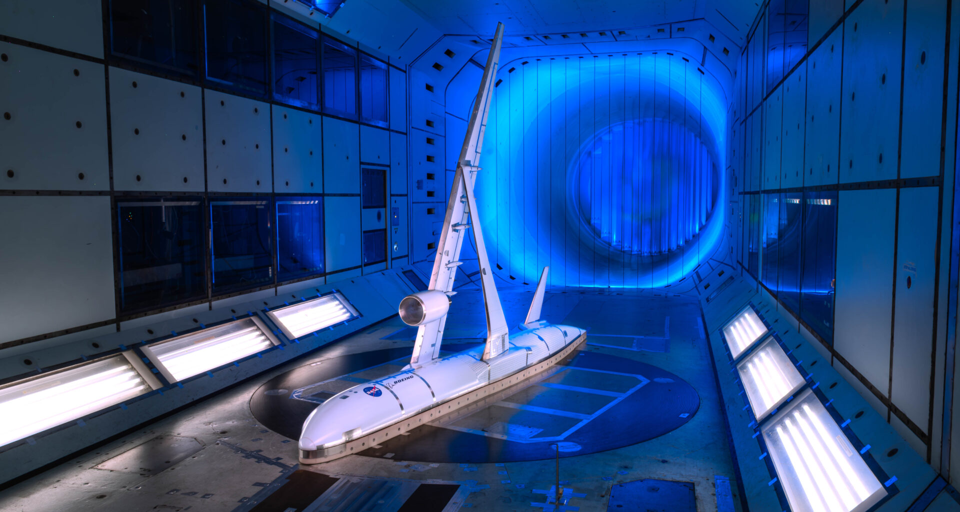A scale model of a subsonic aircraft is tested inside a wind tunnel.