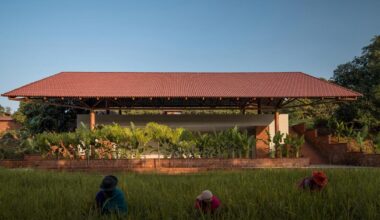 gabled roof floats over gathering pavilion’s brick plinths in india