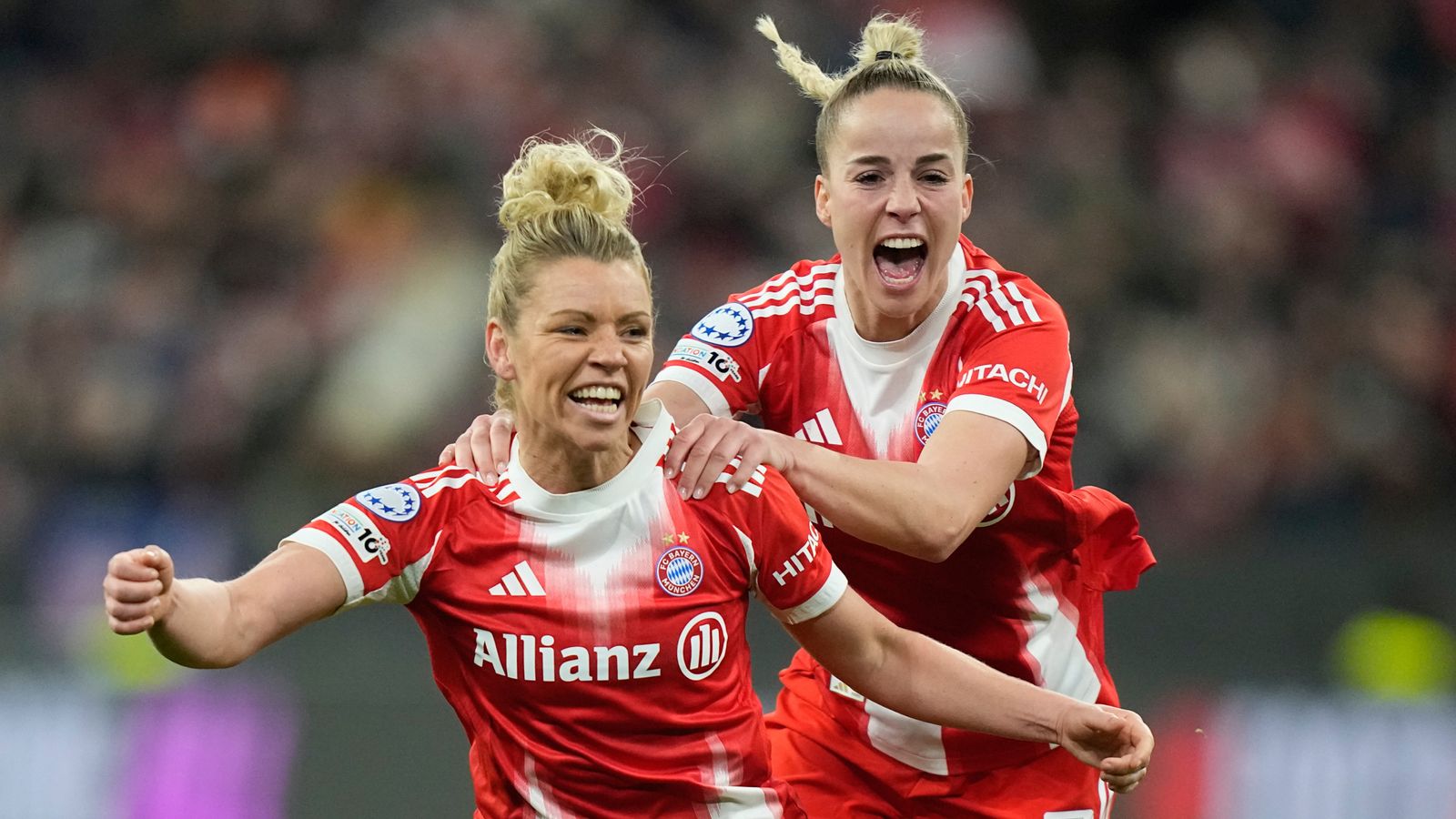 Bayern's Linda Dallmann, left, celebrates with Giulia Gwinn after she scores her side's second goal against Man Utd