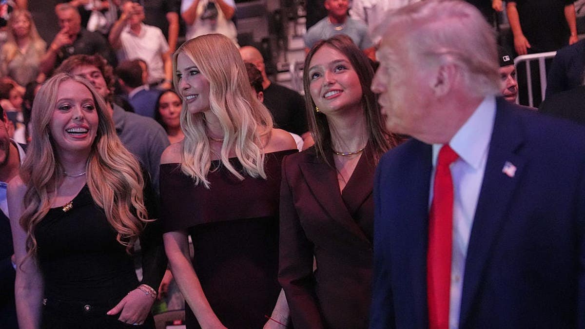 Tiffany Trump, Ivanka Trump and Arabella Kushner standing behind President Donald Trump at UFC event
