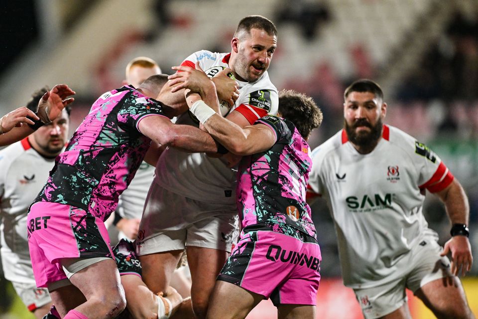 Northern Ireland , United Kingdom - 4 April 2026; Stuart McCloskey of Ulster is tackled by Sam Parry, left, and Dan Edwards of Ospreys during the EPCR Challenge Cup match between Ulster and Ospreys at Affidea Stadium in Belfast. (Photo By Ramsey Cardy/Sportsfile via Getty Images)
