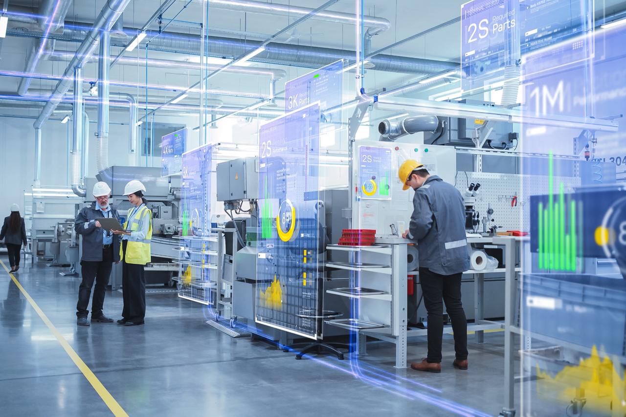 Engineers monitor AI-driven production systems and real-time data analytics inside a high-tech manufacturing facility, reflecting the shift toward Industry 4.0 and automation. (Adobe Stock Photo)