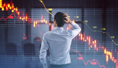 Investor looking at a declining stock chart.