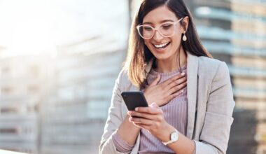 A person looks surprised while using a smartphone.