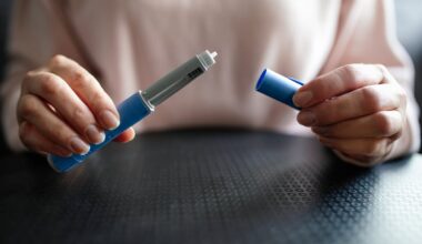 A person opens a GLP-1 shot