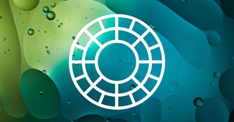 A white circular grid icon with evenly spaced segments is centered on a blue-green abstract background featuring bubbles and organic shapes.