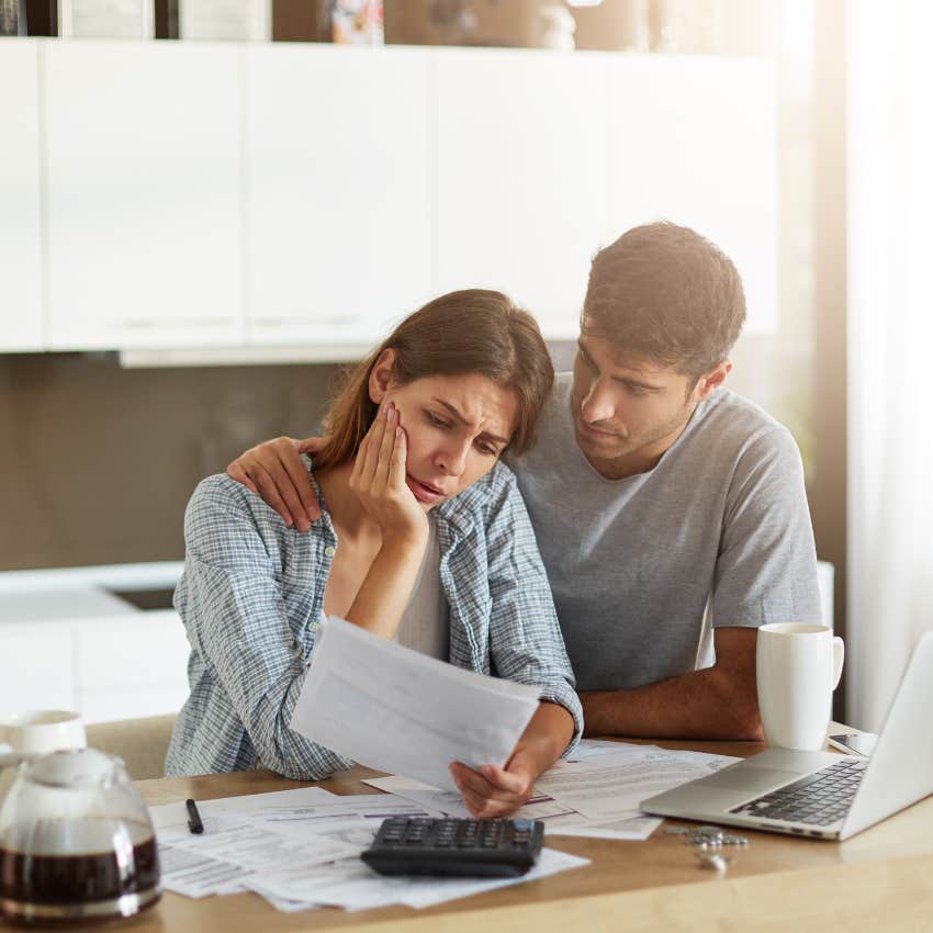 young couple struggling to pay bills despite being hard workers