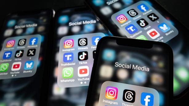 In this photo illustration, iPhone screens display various social media apps on the screens