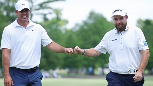 AVONDALE, LOUISIANA - APRIL 23: Brooks Koepka (L) of the United States and Shane Lowry of Ireland react after Lowry's birdie on the fourth hole during the first round of the Zurich Classic of New Orleans 2026 at TPC Louisiana on April 23, 2026 in Avondale, Louisiana. (Photo by Chris Graythen/Getty I
