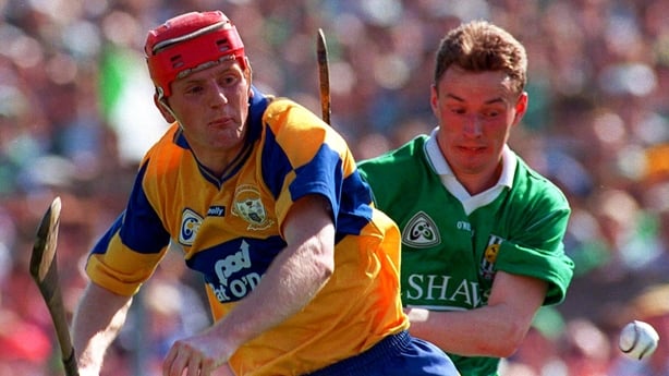Clare manager Brian Lohan in action against Limerick's Owen O'Neill during the 1996 Munster SHC