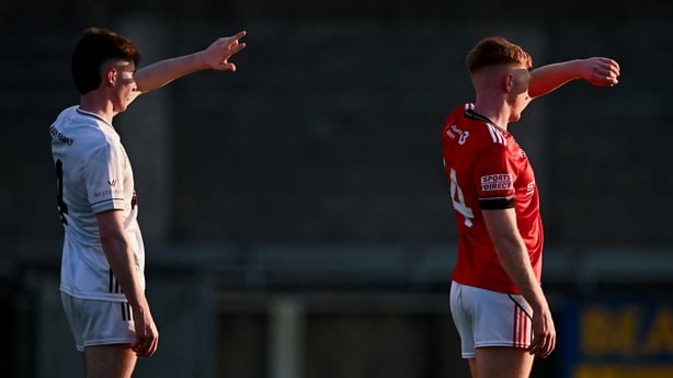 6 May 2026; Senan Gallagher of Kildare and Sean Flynn of Louth shield themselves from the harsh sun as they watch play downfield during the Dalata Hotel Group Leinster Under-20 Football Championship final match between Louth and Kildare at Parnell Park in Dublin. Photo by Piaras Ó Mídheach/Sportsfil