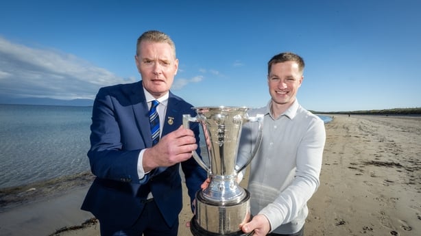 Repro Free fro Munster GAA :: The launch of Corn Pháidí Uí Shé, the new trophy for the Munster Senior Football Championship, took place on Wednesday, May 6th, at 8.00pm in Páidí Ó Sé's Pub, Ventry, Co. Kerry. Pictured walking on Ventry beach are Munster GAA Chairman Tim Murphy and Pádraig Óg Ó Sé So