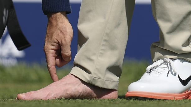 NEWTOWN, PENNSYLVANIA - MAY 12: Rory McIlroy of Northern Ireland looks at his foot on the fourth tee during a practice round prior to the PGA Championship at Aronimink Golf Club on May 12, 2026 in Newtown, Pennsylvania. (Photo by Emilee Chinn/Getty Images)
