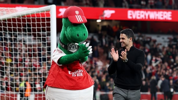 LONDON, ENGLAND - MAY 18: Gunnersaurus, Mascot of Arsenal, and Mikel Arteta, Manager of Arsenal, applaud the fans after the team's victory in the Premier League match between Arsenal and Burnley at Emirates Stadium on May 18, 2026 in London, England. (Photo by Julian Finney/Getty Images)