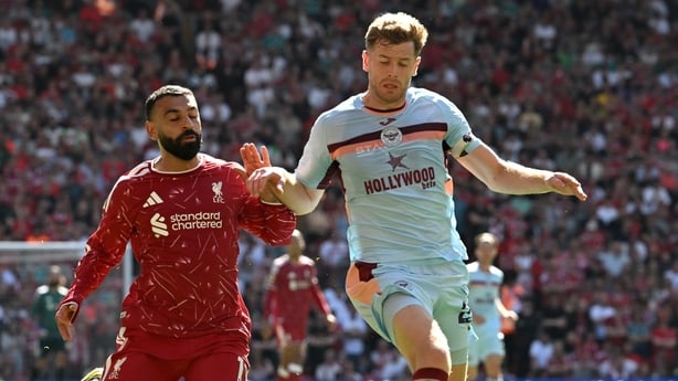 Mohamed Salah of Liverpool challenges Nathan Collins of Brentford during the Premier League match between Liverpool and Brentford at Anfield on May 24, 2026 in Liverpool, England.