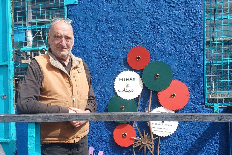Artist Brian Hackett pictured with his 'Minab' sculpture outside his workshop in Ballylongford. Photos by Jack Joy