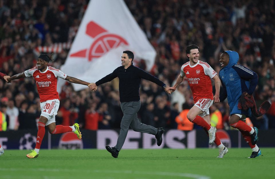 Arsenal's Noni Madueke, manager Mikel Arteta, Declan Rice and Eberechi Eze celebrate after reaching the Champions League final.