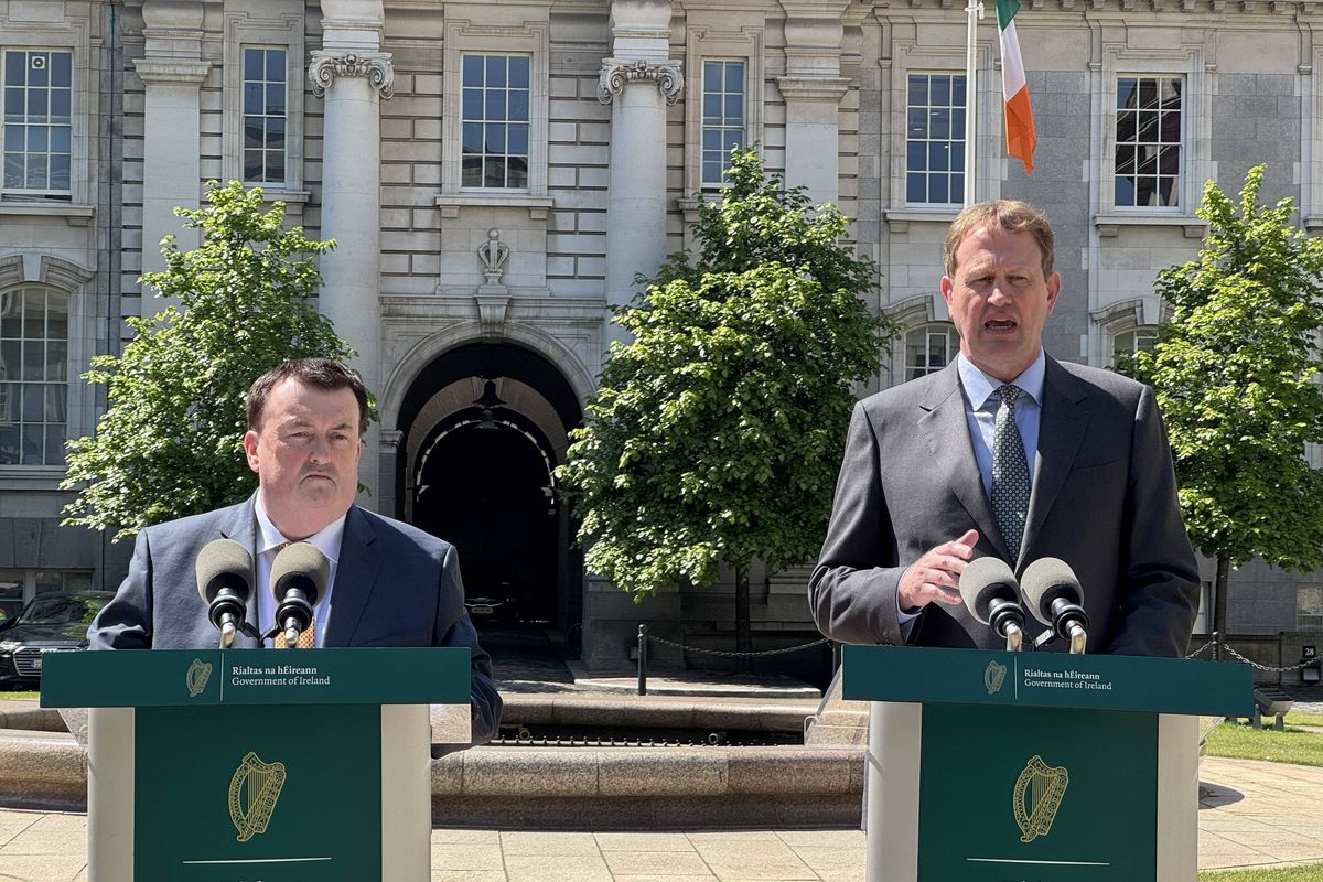 Minister of State for Migration Colm Brophy and Minister for Migration Jim O'Callaghan speaking to the media at Government Buildings in Dublin.