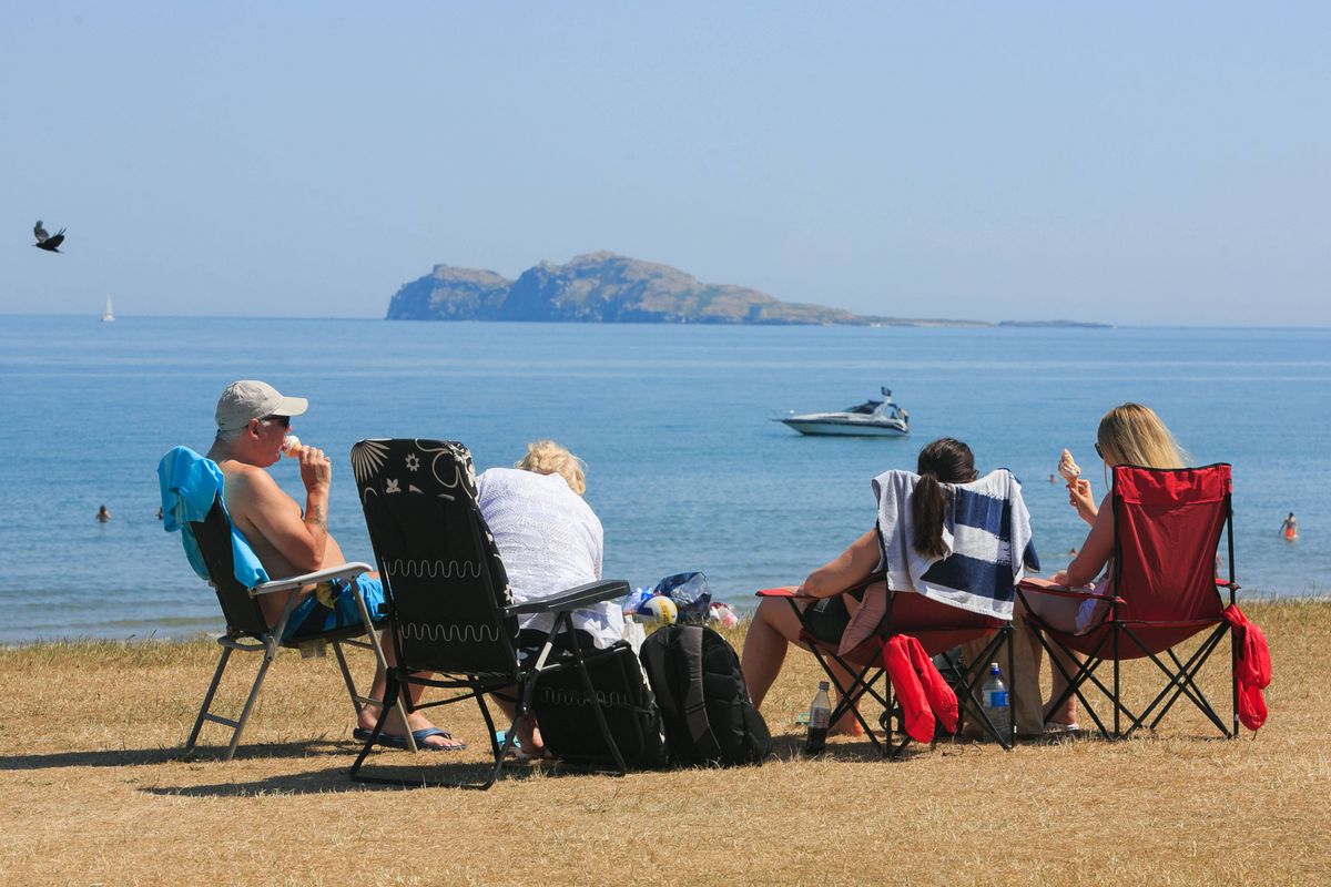 People enjoying the good weather on Portmarnock Beach, Dublin on June 28, 2018