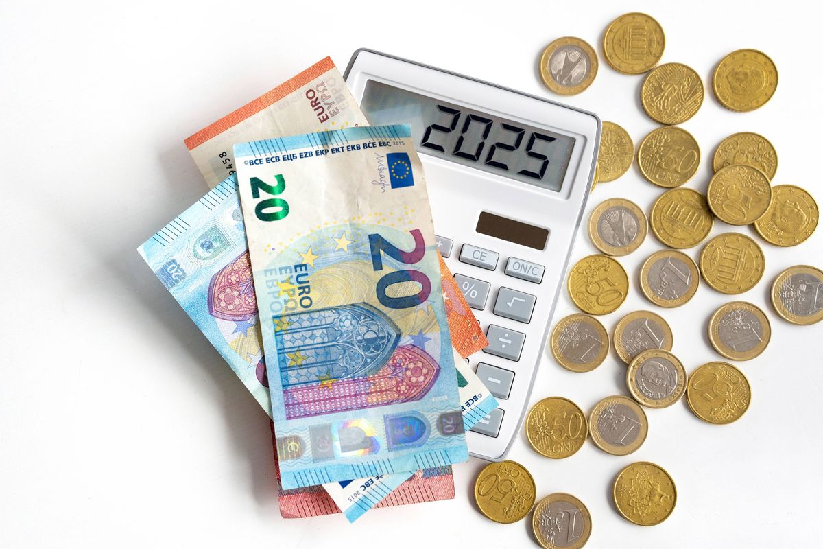 Euro notes and coins with a calculator