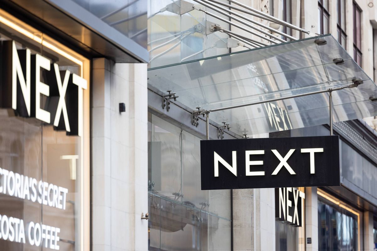 A sign above the entrance to a Next Plc store on Oxford Street in London, UK, on Tuesday, Jan. 7, 2025. Next said there will be a slowdown in sales and profit over the coming year as tax hikes take their toll. Photographer: Chris Ratcliffe/Bloomberg via Getty Images