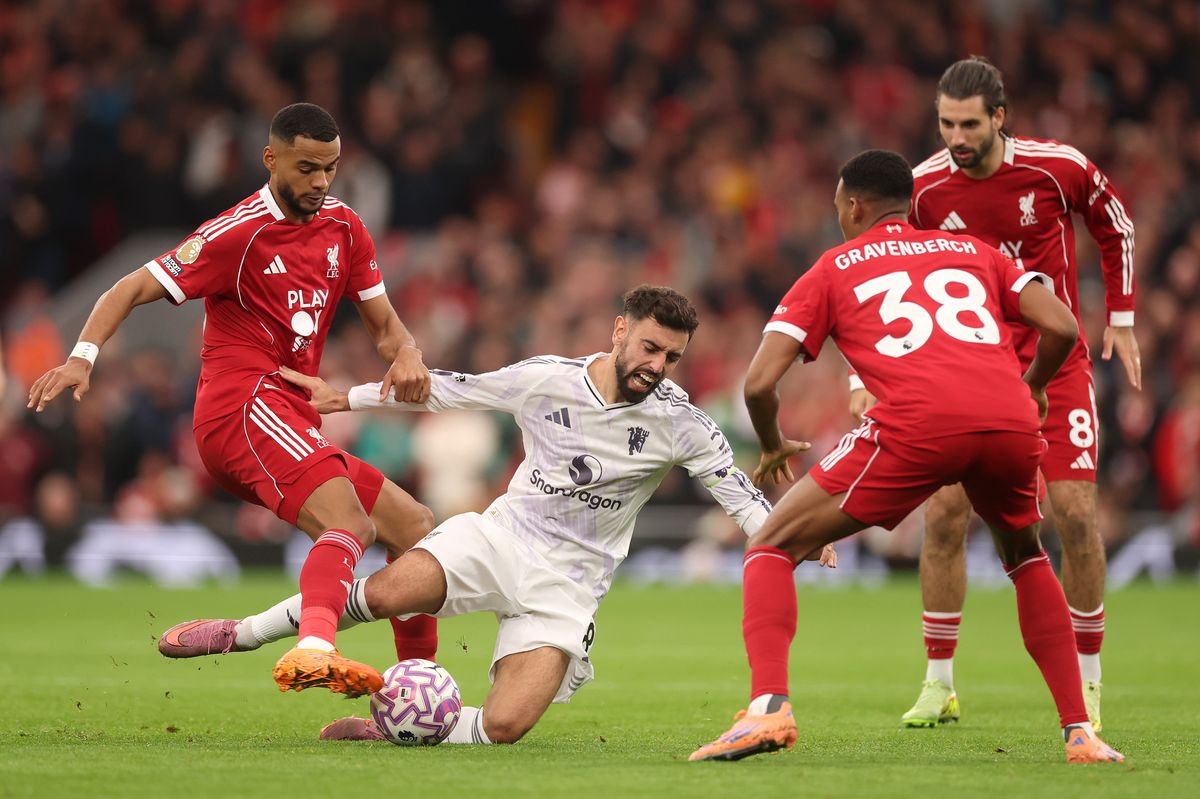 Bruno Fernandes of Manchester United is challenged by Cody Gakpo of Liverpool during the Premier League match between Liverpool and Manchester United