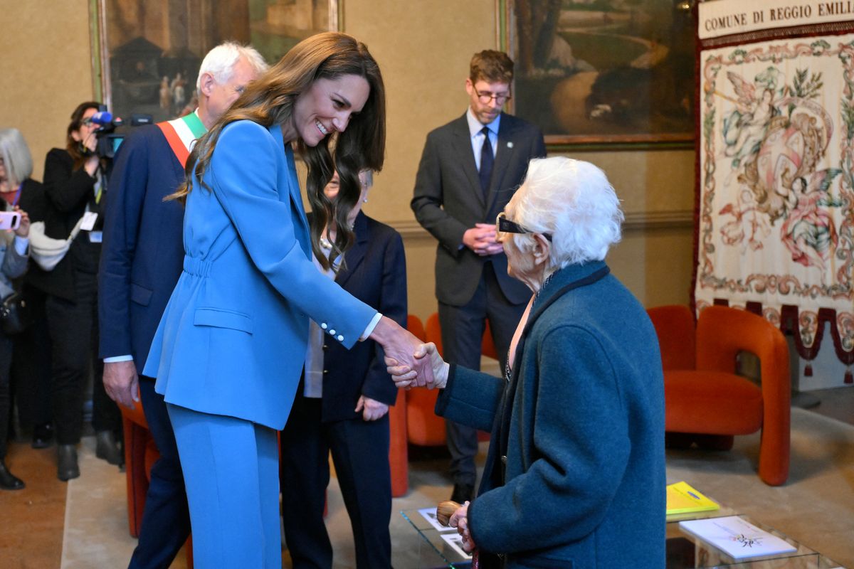 Kate meets a group of nonnas in Reggio Emilia town hall 