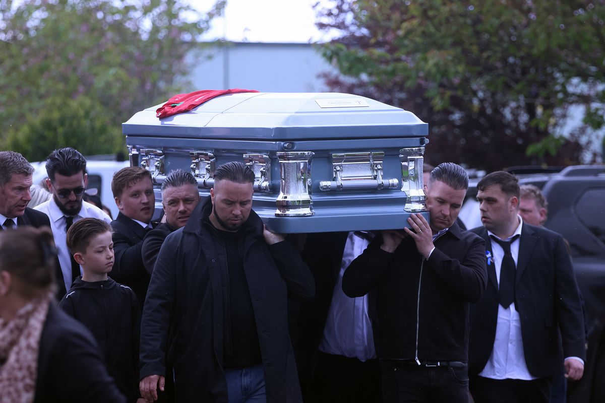 The remains of Callum Hutchinson are carried into the church ahead of his funeral in Borrisokane