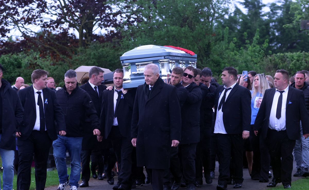 Mourners carrying the coffin exit the church following the funeral mass Callum Hutchinson Funeral in Borrisokane
