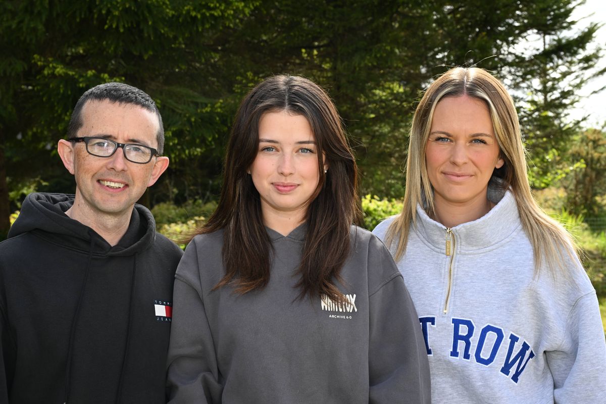 Brooke Coleman (centre) with dad Damien and mother Jessica