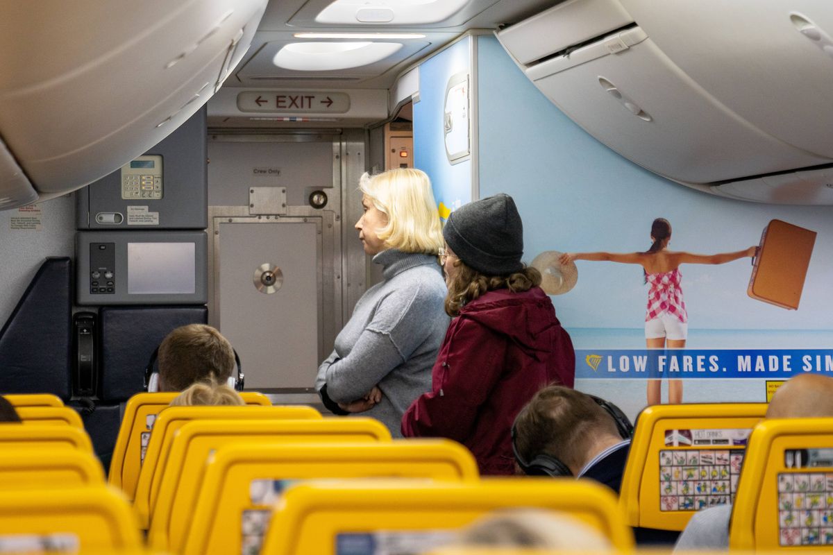 Vilnius, Lithuania - January 15, 2020: People Are Waiting in Line to get to Toilet in Ryanair Airplane. Trip to London Stansted Airport.
