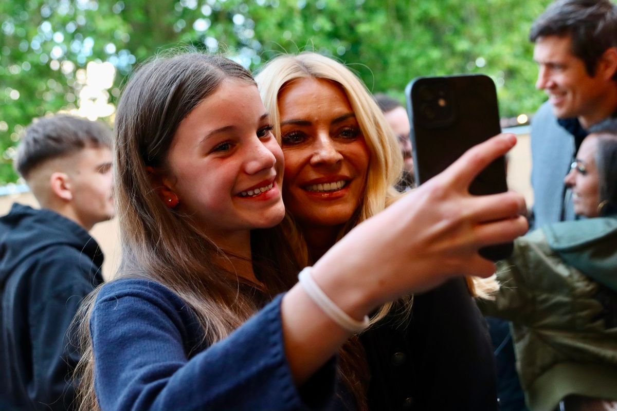 Tess was all smiles as she posed for selfies