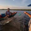 Local fisheries on the coast of Cambodia struggled with decimated fish populations for years. Today, they are teaming with seafood, thanks to local ecological restoration efforts. Here, on right, Koh Kresna village chief Khiev Sat talks with a fisherman about the day’s catch.