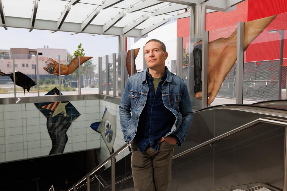  Artist Karl Haendel stands in front of his work inside the Wilshire/Fairfax Metro Station
