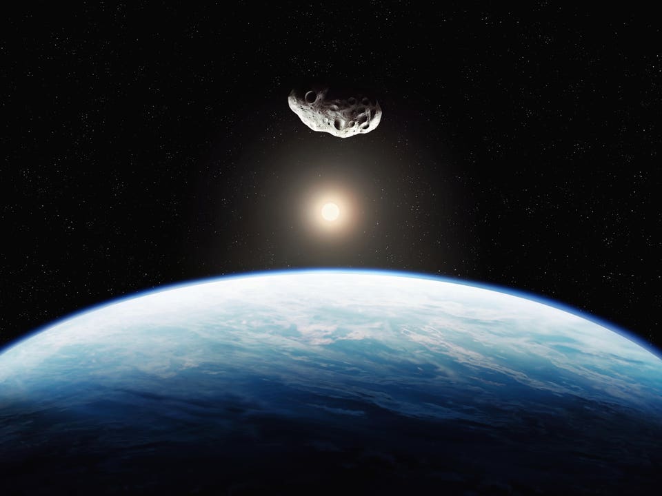 Asteroid approaching the blue planet.