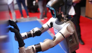 Humanoid robots strut their stuff as trade show comes to Japan