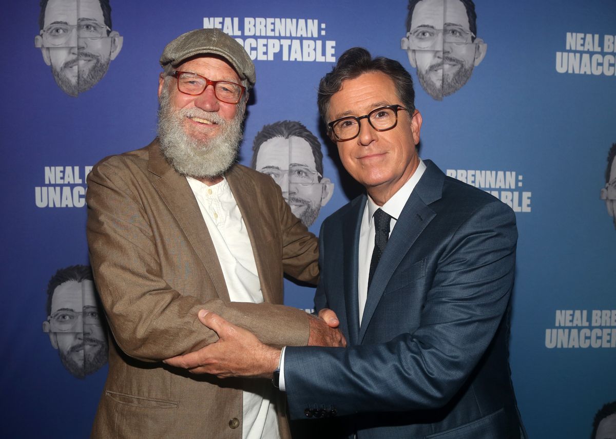 David Letterman and Stephen Colbert pose at the opening night arrivals for "Neal Brennan's Unacceptable" at the Cherry Lane Theatre on September 9, 2021 in New York City.