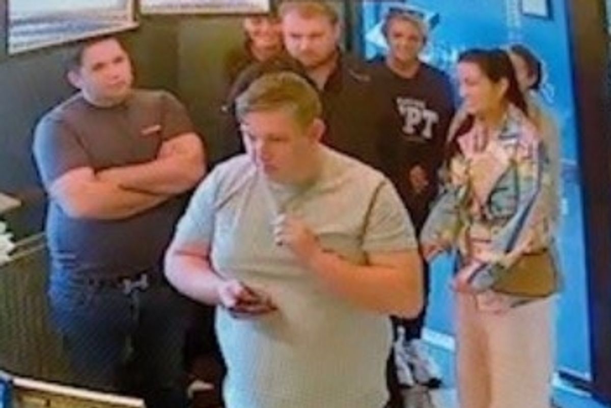 Police officers have released CCTV images of a group of people they wish to speak to following a theft in Kettering.