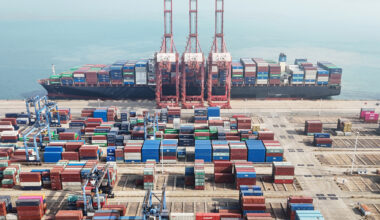 Shipping containers are stacked on April 12, 2024, at a port in Lianyungang, in eastern China's Jiangsu province.