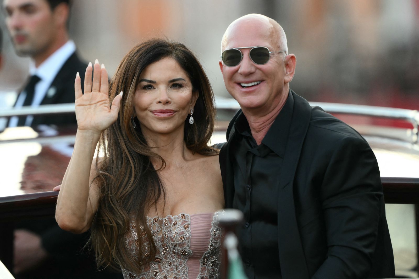 Image may contain Jeff Bezos Laura Snchez Face Happy Head Person Smile Photography Portrait Blazer and Clothing