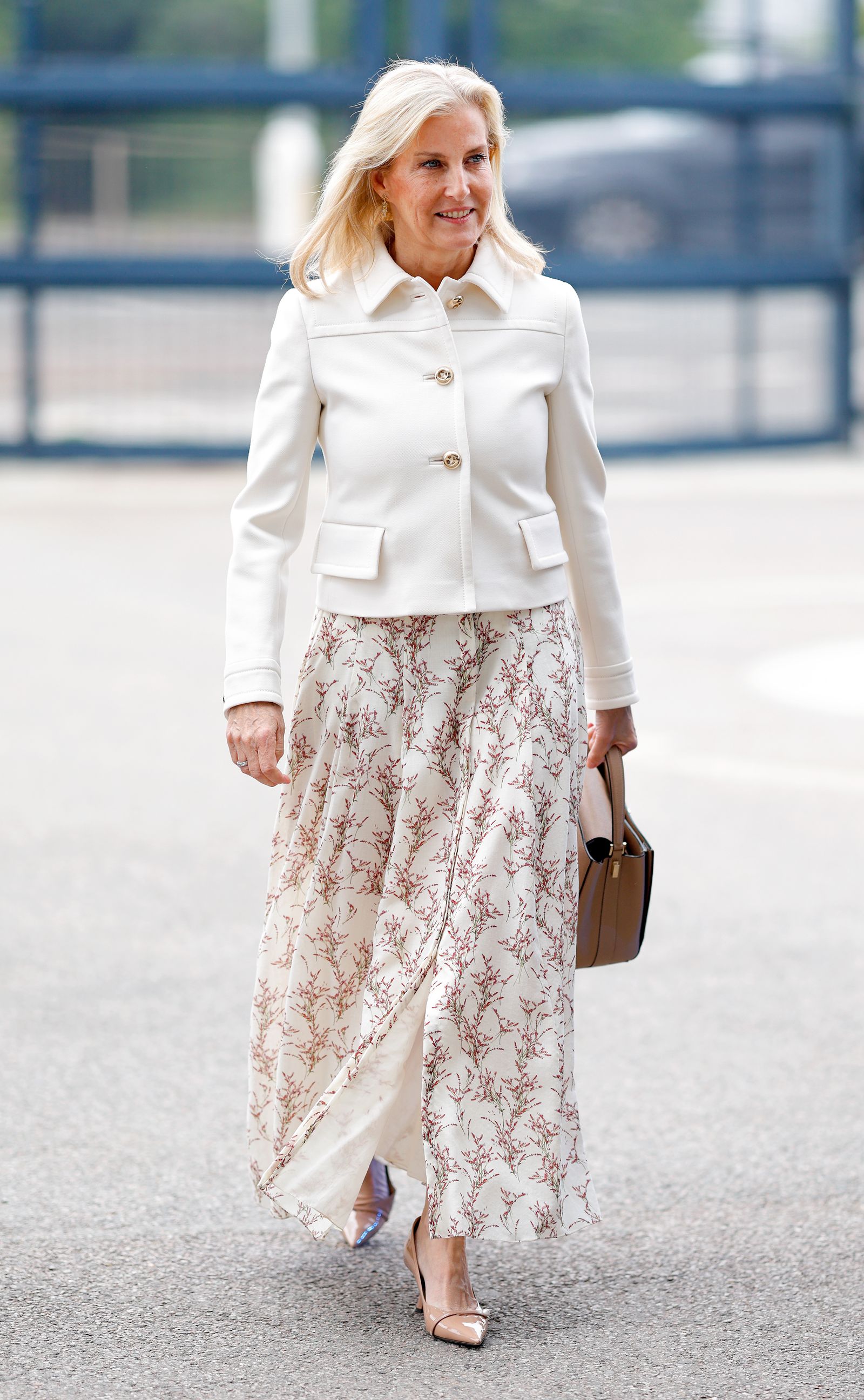 Image may contain Sophie Countess of Wessex Person Clothing Skirt Adult Accessories Bag Handbag and Coat