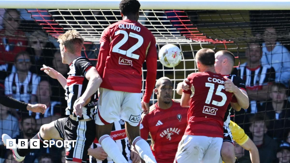 Salford defender Adebola Oluwo heads towards goal