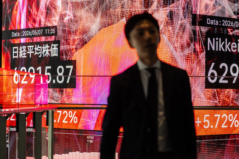An electronic quotation board displays the Nikkei 225 stock prices on the Tokyo Stock Exchange in Tokyo on Thursday. Photo by Philip Fong/AFP via Getty Images